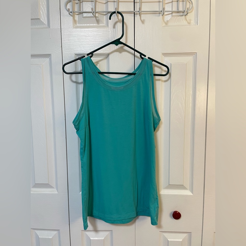 Columbia sleeveless shirt, size Medium; Teal; polyester, rayon, viscose.
